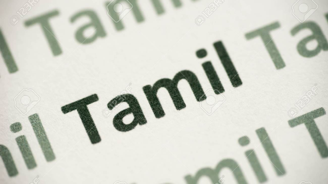 107233233-word-tamil-language-printed-on-white-paper-macro.jpg