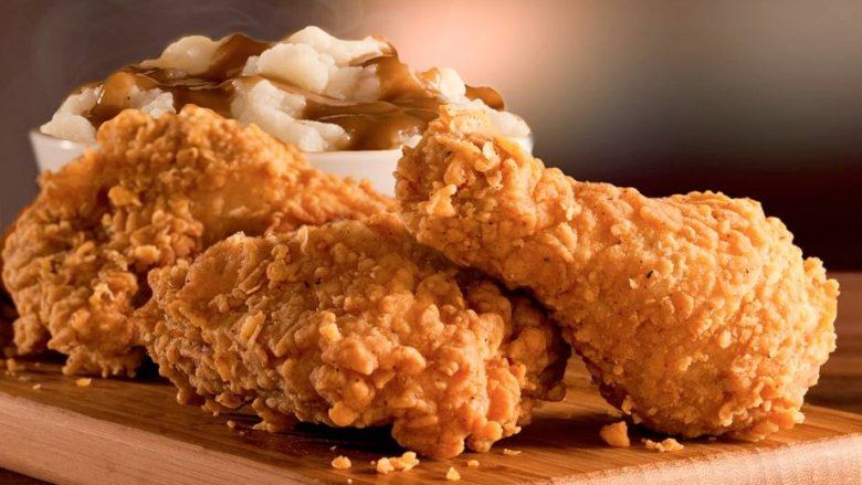 woman finishes kfc fried chicken in front of customs officers after she was stopped from bringing it into singapore from johor