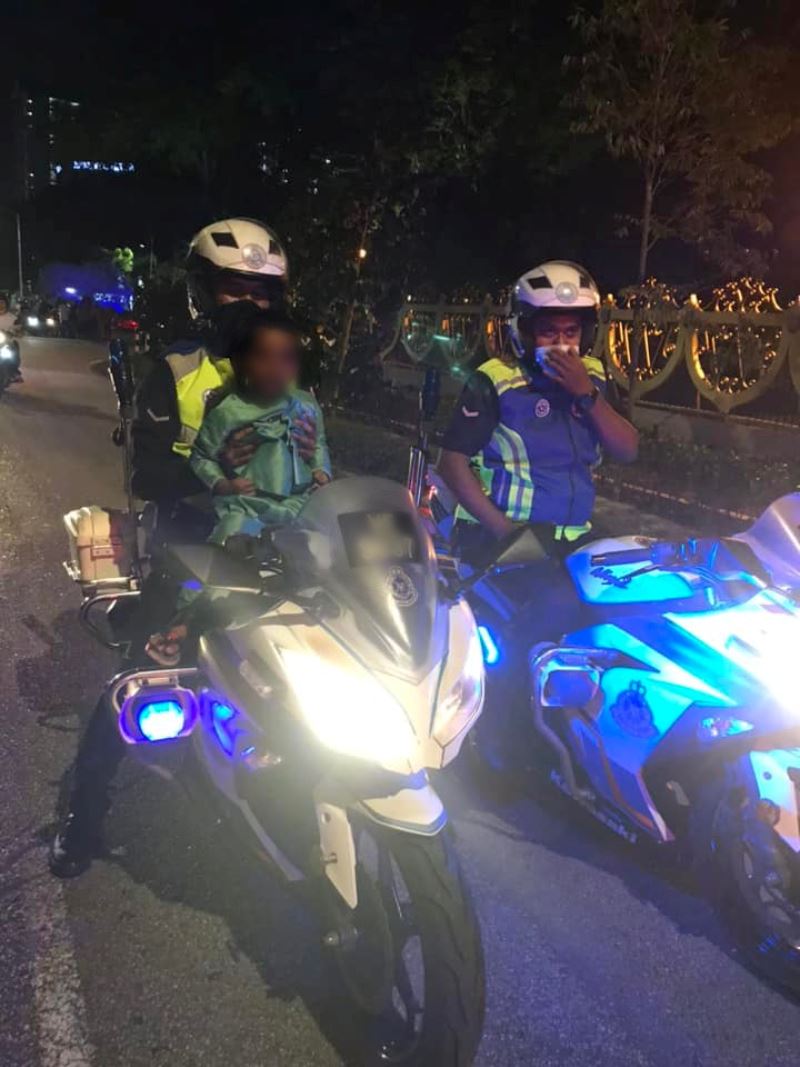 pdrm officers fulfill young boy’s wish to sit on patrol motorcycle