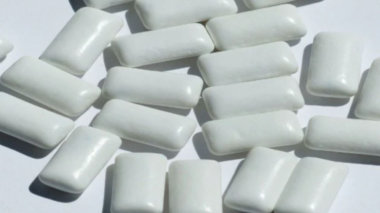 how cool! this experimental chewing gum can trap covid-19 in your saliva