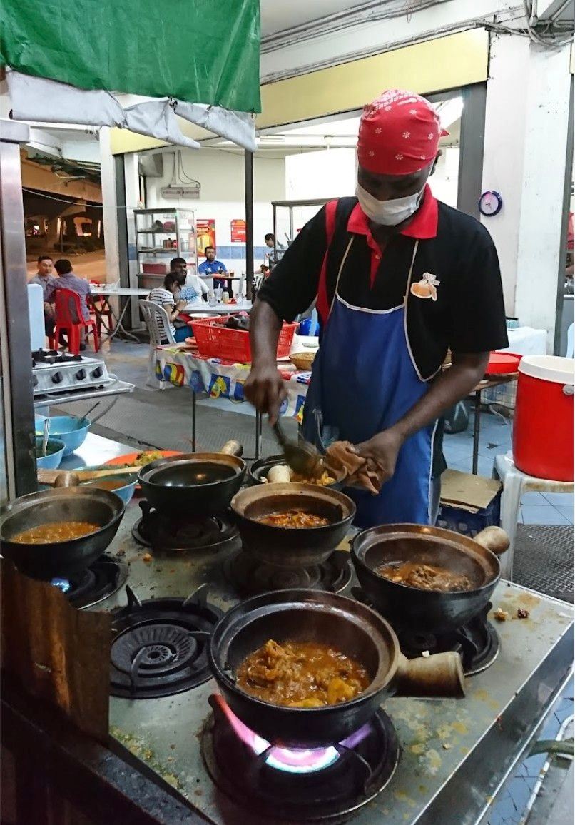 “tastes like chicken!” this stall in kl sells monitor lizard curry claypot rice