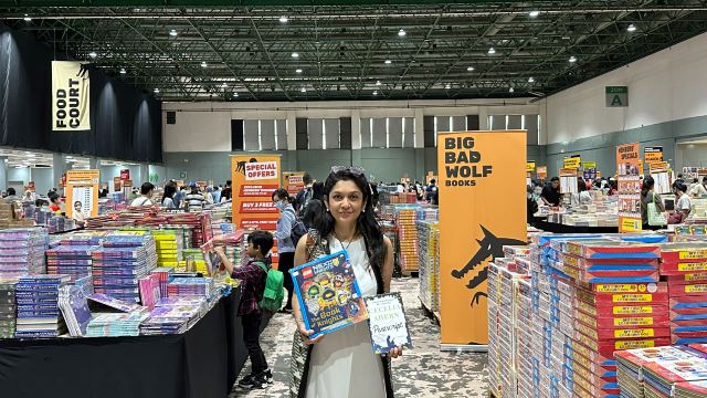 ms-geetha-nair-head-of-pr-at-big-bad-wolf-books-showing-some-of-the-books-available-at-the-big-bad-wolf-book-sale-kuala-lumpur-2022-1.jpg