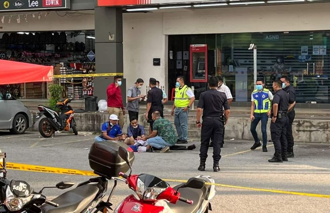 lone robber shoots security guards during a heist in puchong