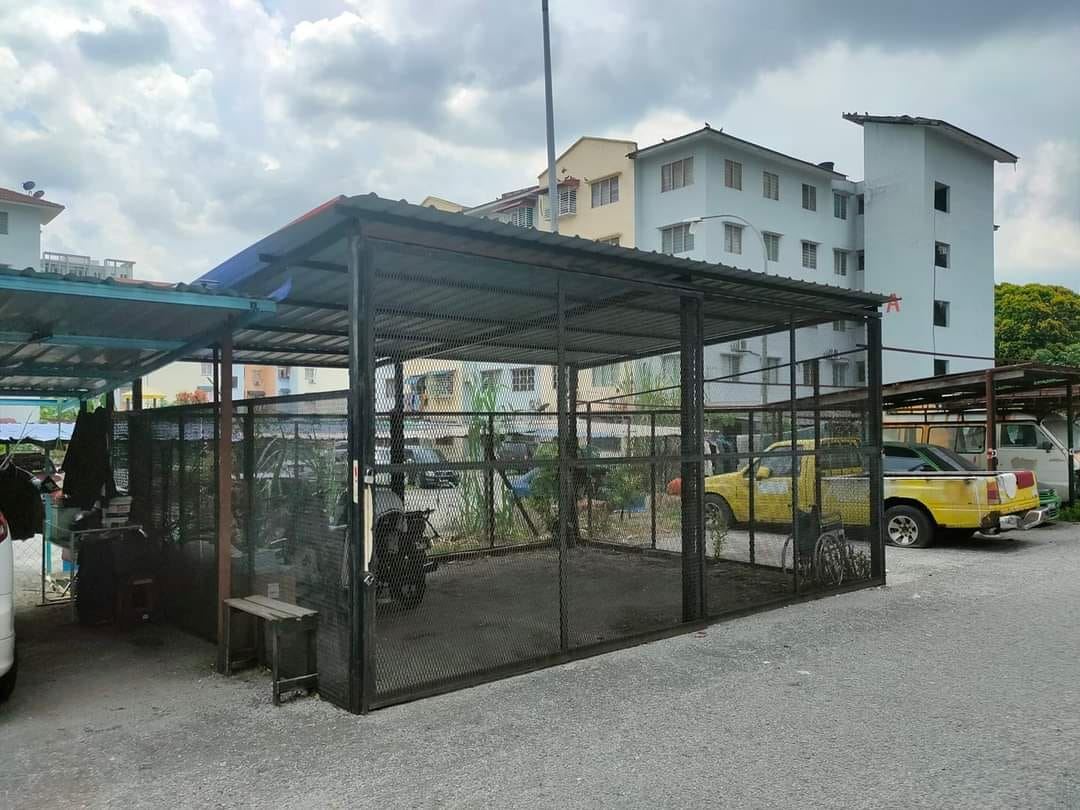 m’sians criticise selfish resident for building a “caged garage” at flat building’s parking area