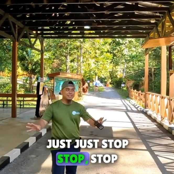 criticism arises as visitors disregard instructions to distance themselves from orangutan at malaysian wildlife centre