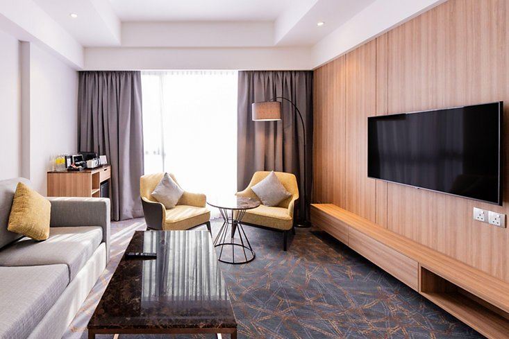 a room with a sofa and a television