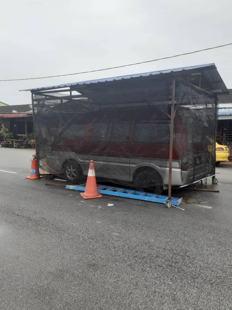 m’sians baffled after photo of “parking shed” built in the middle of the road went viral!