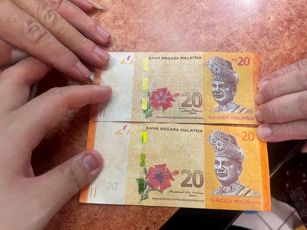 fourteen traders in sarawak lodge police report over fake rm20 notes