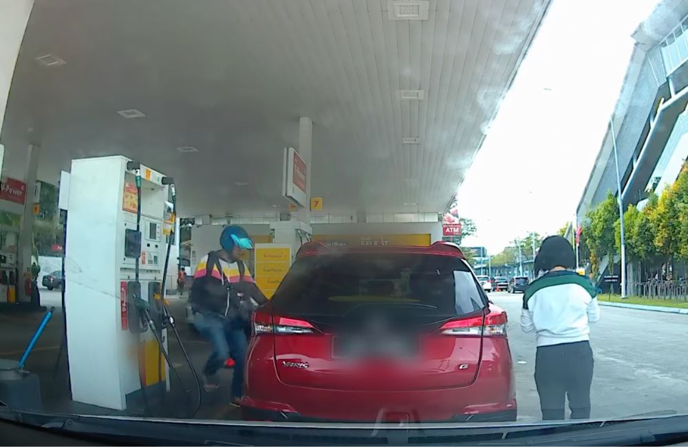 woman robbed at petrol station, didn’t realise a man was waiting for her to unlock her car