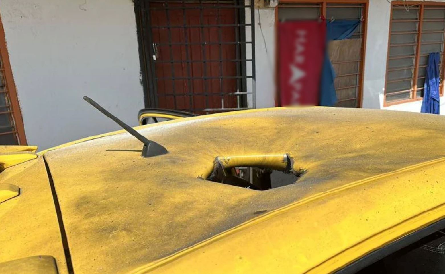 police investigates hole in car roof believed to have been caused by “man-made” explosive