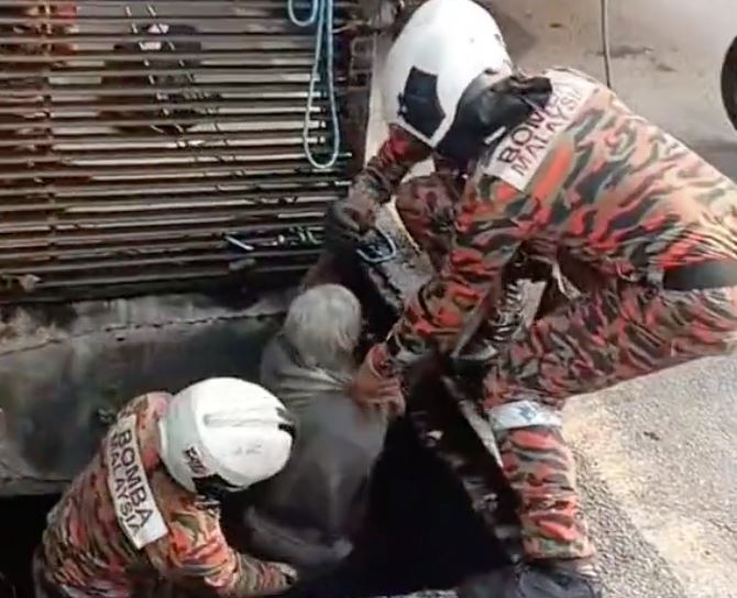 heroic abang bomba saves elderly homeless man trapped in 2-meter deep drain