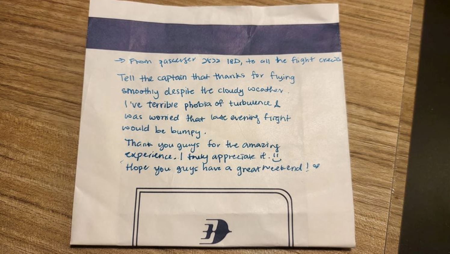 “thank you, captain!” photo of passenger expressing gratitude to pilot on unused airsickness bag goes viral!