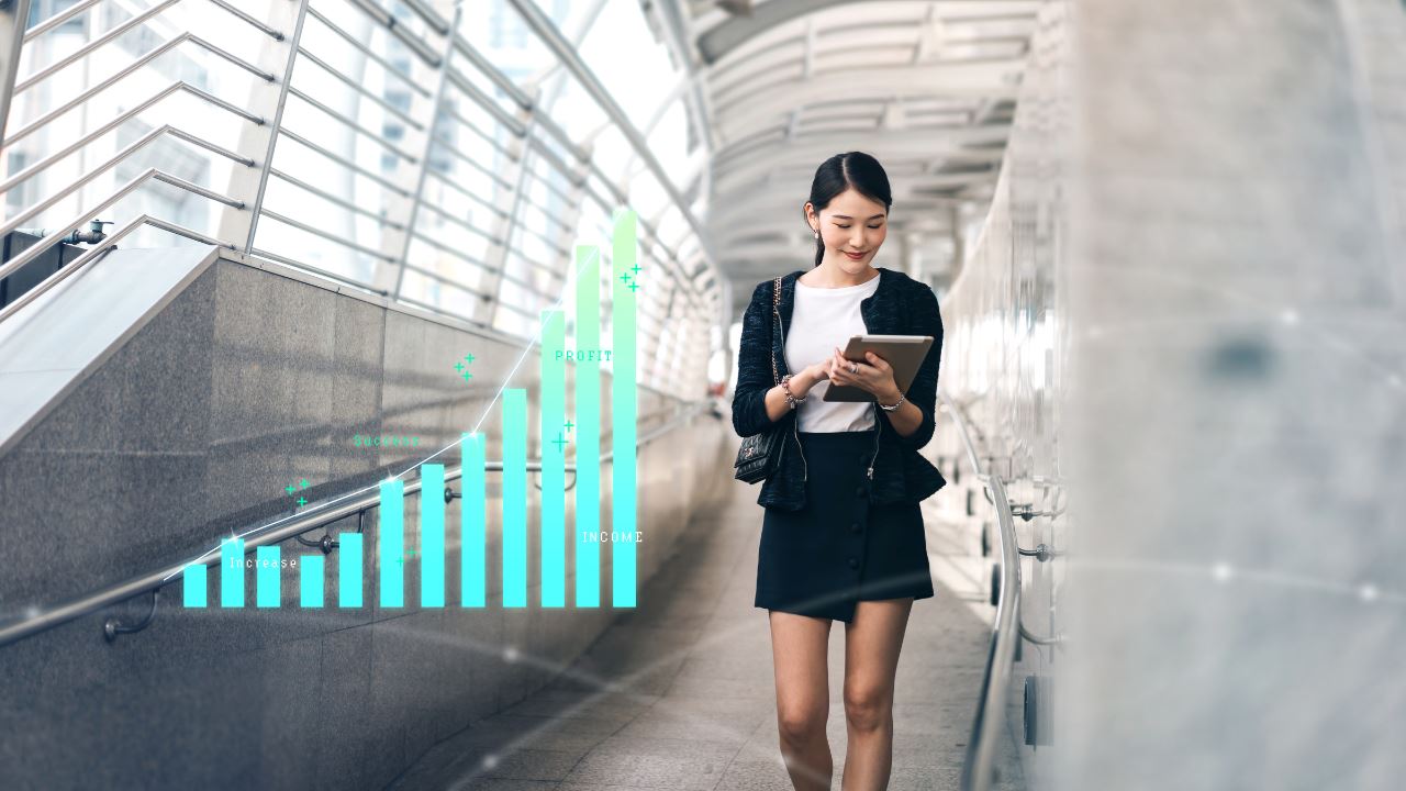 Woman looking down and smiling with a graph graphic beside her