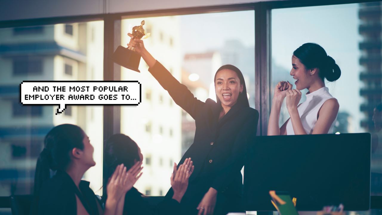 Asian woman holding a trophy to celebrate winning the best employer award