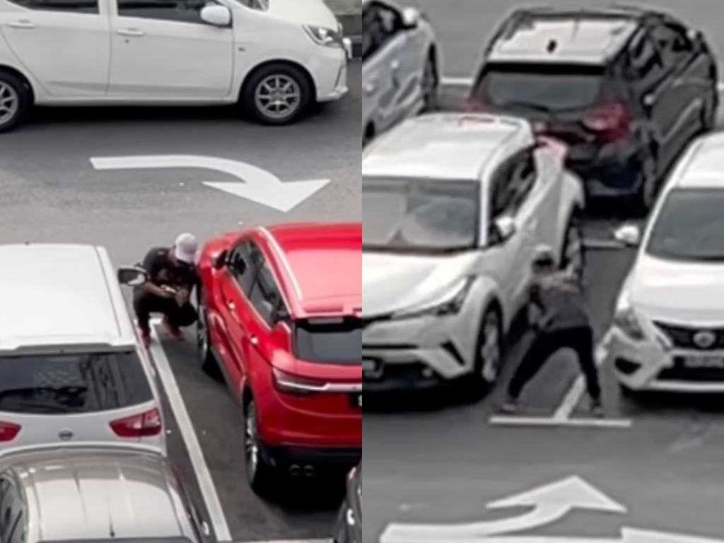 malaysian spots suspicious man photographing car plates and tires at kl mrt parking lot