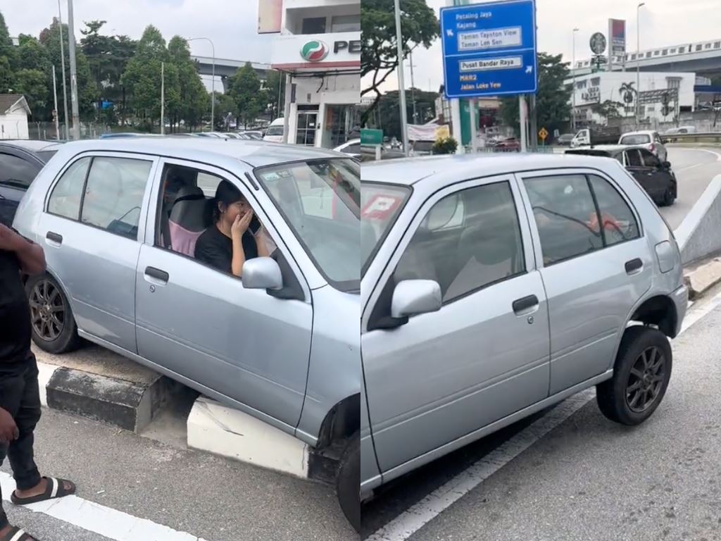 malaysians band together to help shy p-driver who got her car stuck on divider in kl!