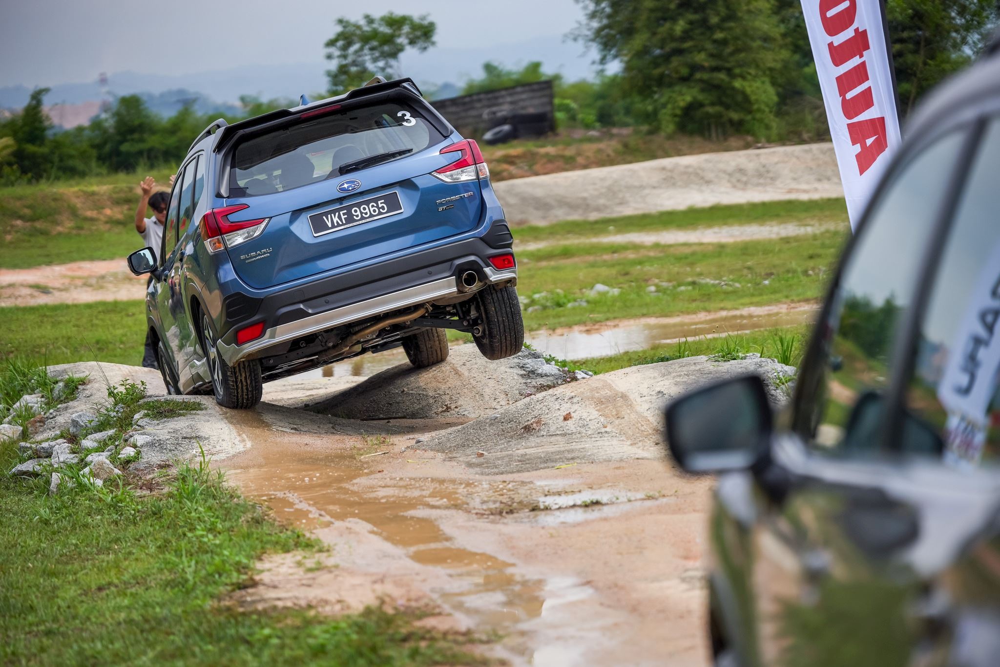 Subaru Forester SUV driving through rough and bumpy terrains