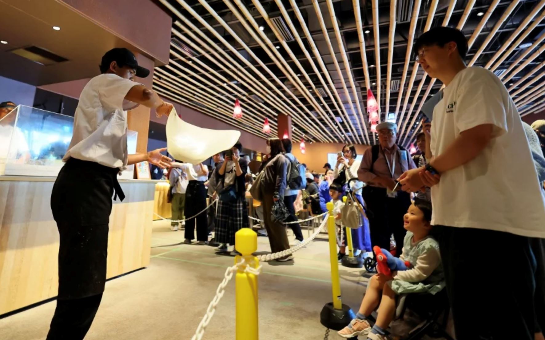 visitors line up for hours to watch malaysia’s flying roti canai at expo 2025 osaka