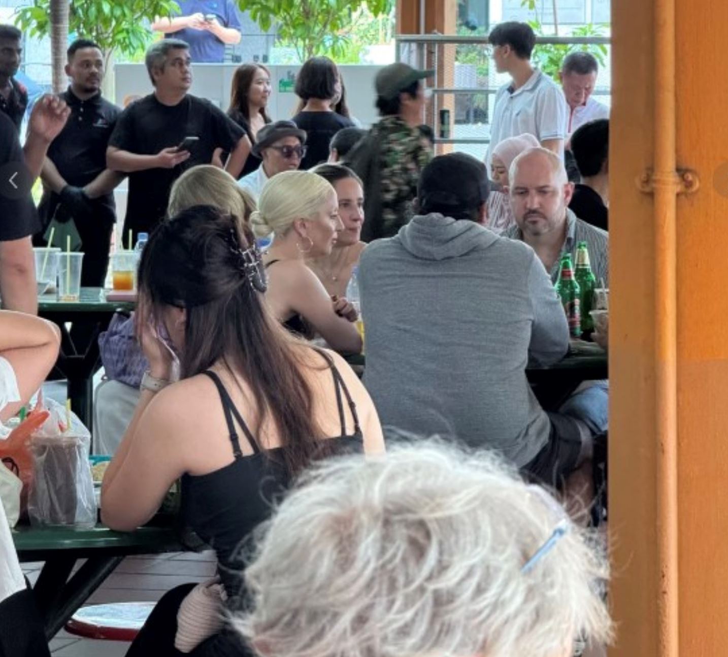 lady gaga spotted flying commercial from singapore, surprises fans with low-key travel style