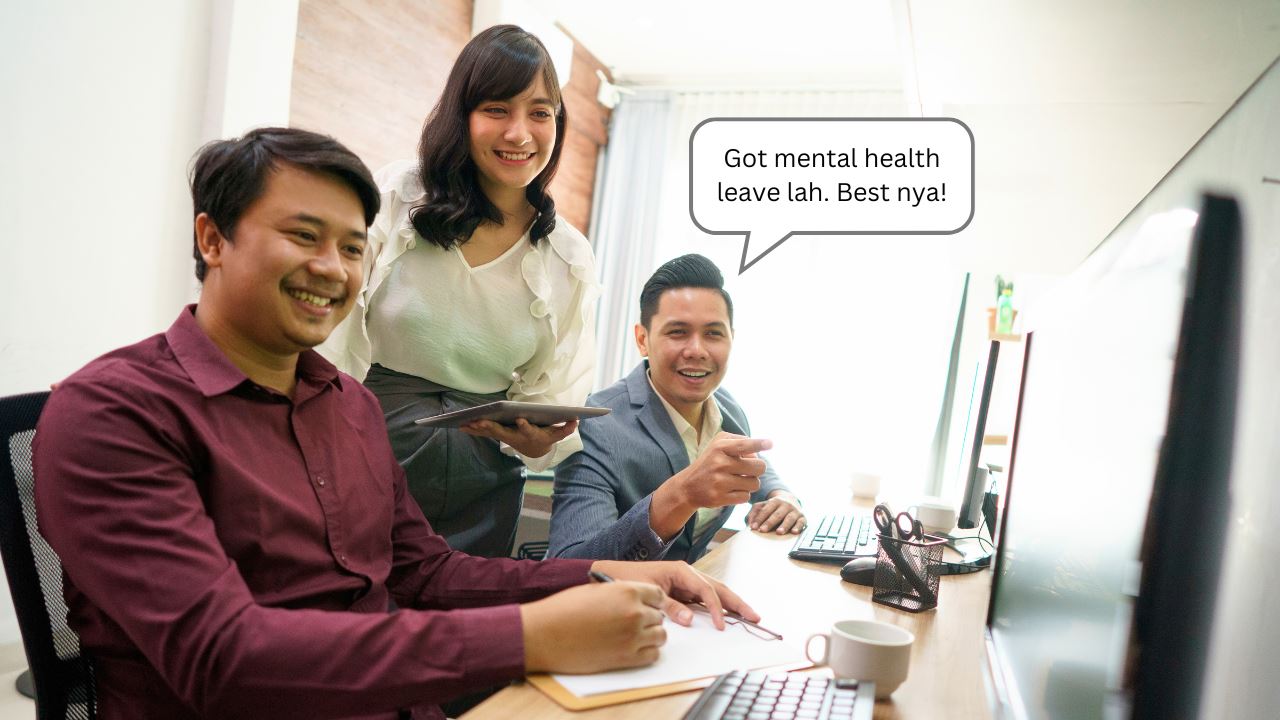 Two men and a lady looking at the computer smiling